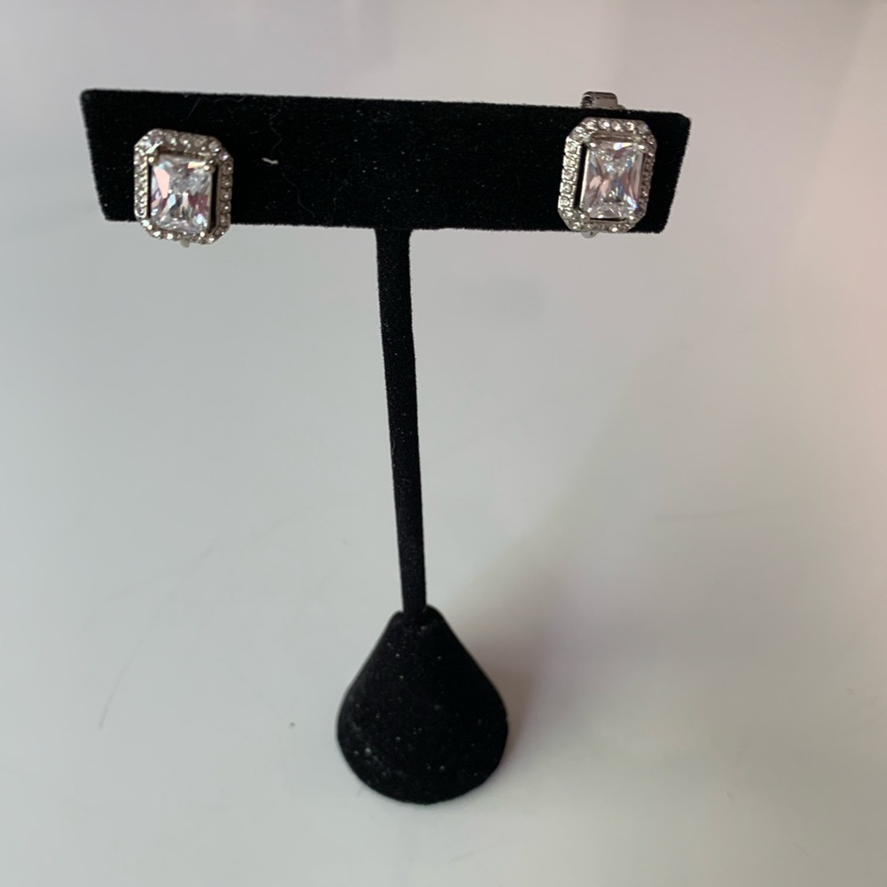 Silver tone and glass clip on earrings.